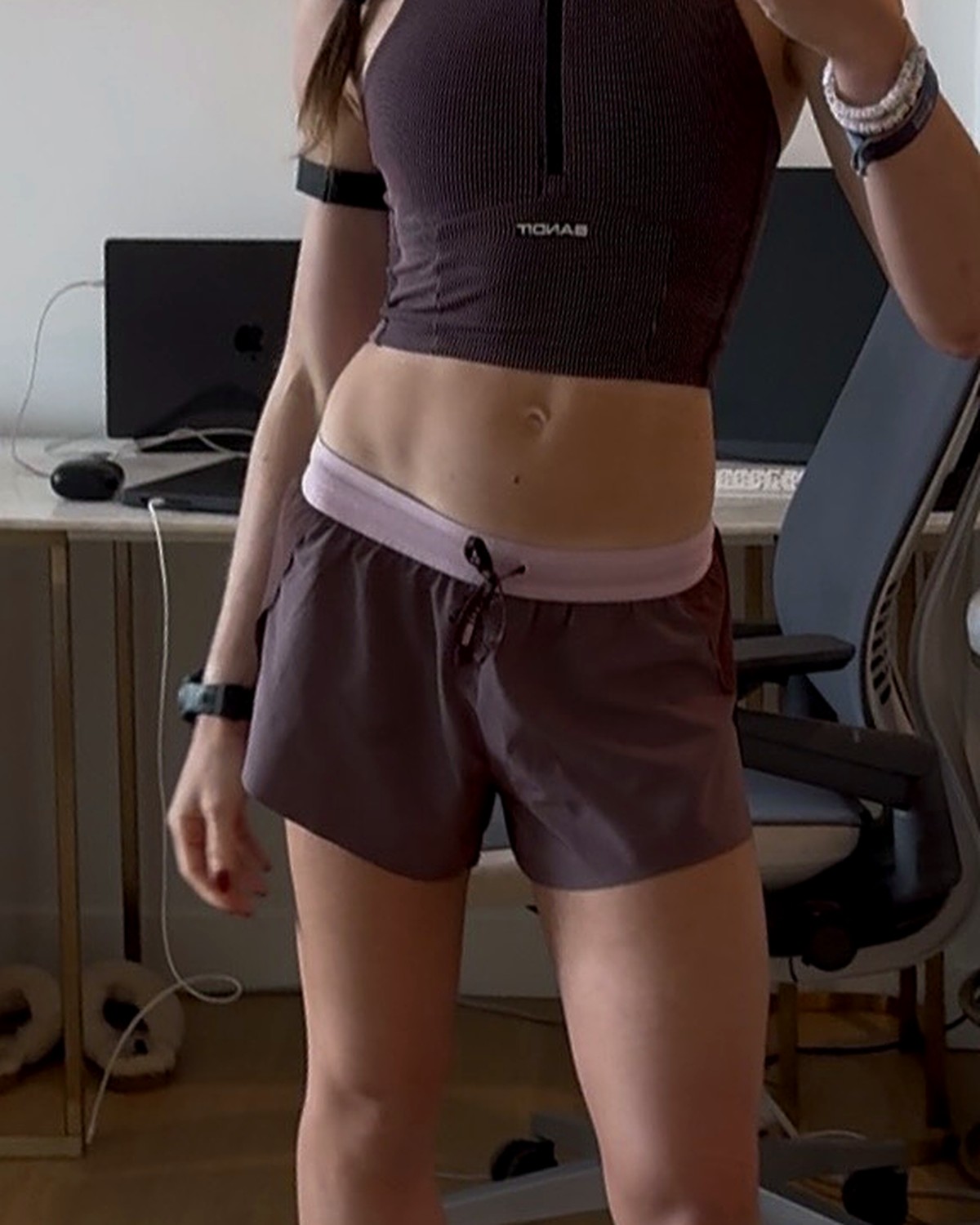 LSKD Accelerate shorts in Mauve, front view, size small, waistband sitting on the hip bones below the navel, worn with a Bandit zip crop